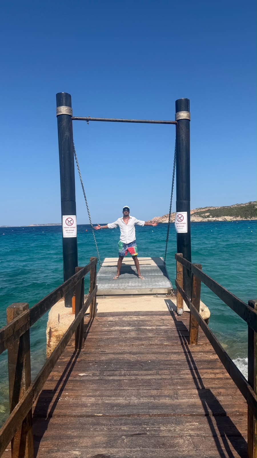 Ronojay Nag away from work, on a jetty by the sea